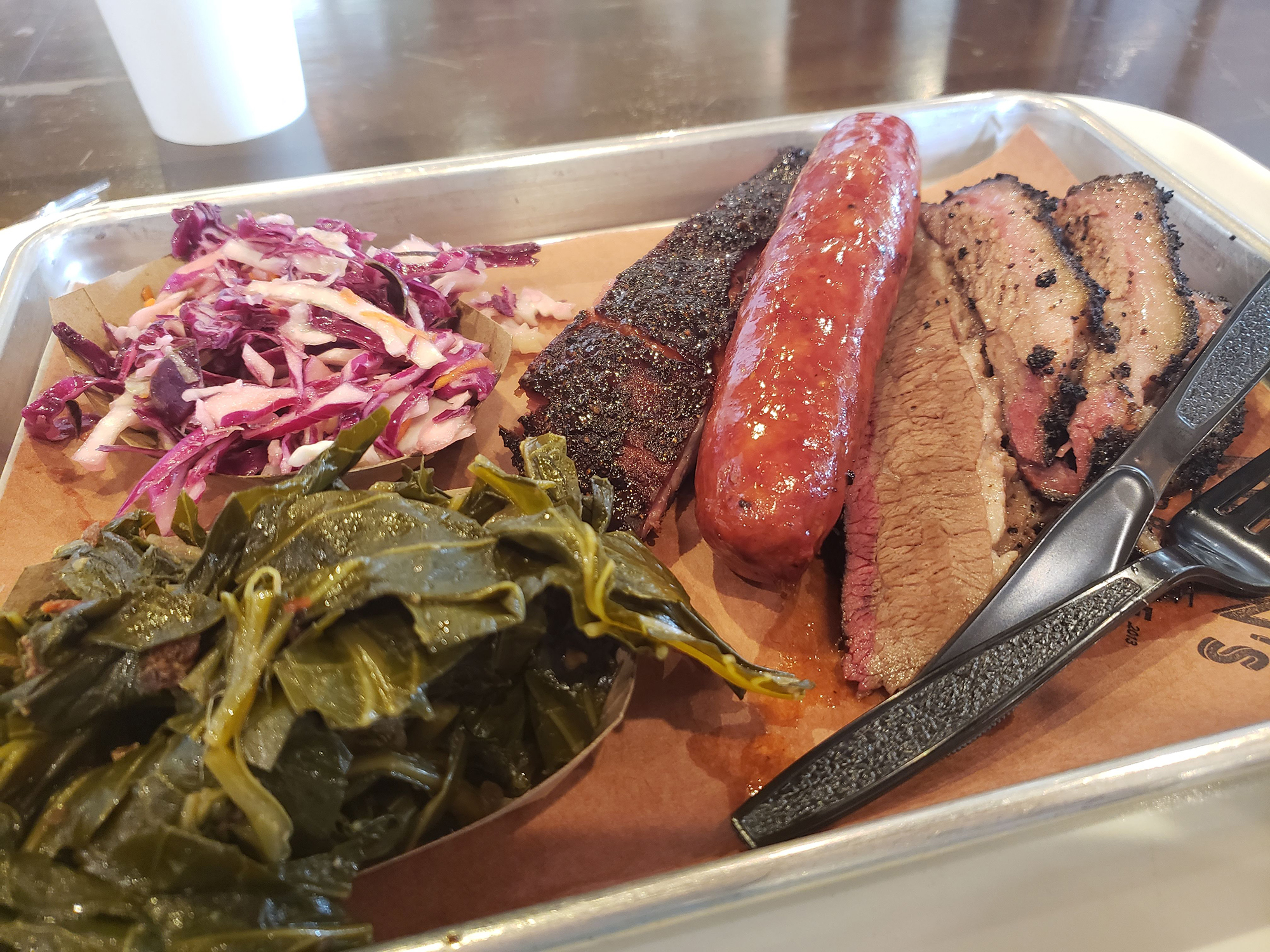 3 meat combo - Texas Sausage, Rib, Brisket with Greens and Red Cabbage Cole Slaw.